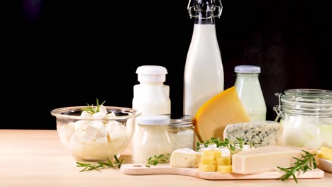 assorted dairy items arranged on a wooden surface