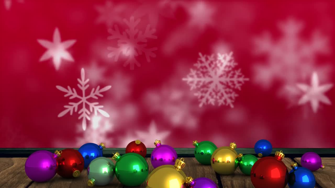 animación de coloridas bolas de navidad sobre copos de nieve sobre fondo rojo