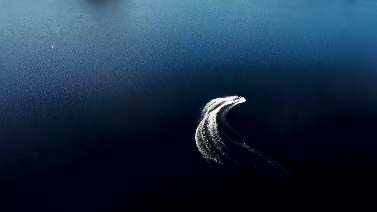 Aerial View of Jet Ski on Dark Blue Water