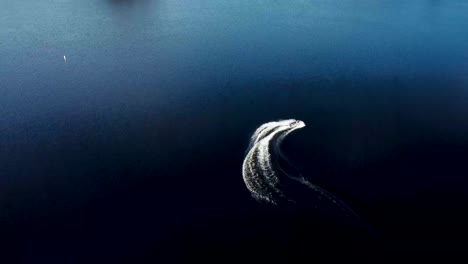 aerial view of jet ski on dark blue water