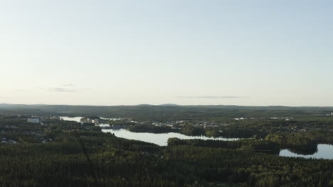 4k-Drone-shot-of-Swedish-woods-and-a-big-river-during-sunset