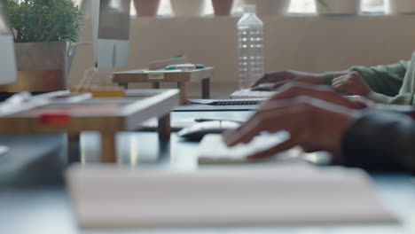 close up hands typing on keyboard professional business people using computer technology online support team working in office