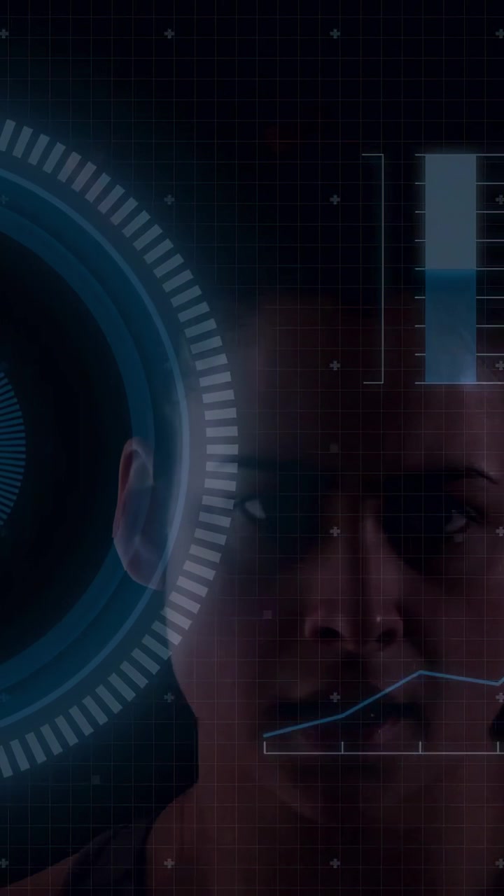 Vertical video: Woman reacting to HUD brightening, touching HUD and tracking tech bar line graphs