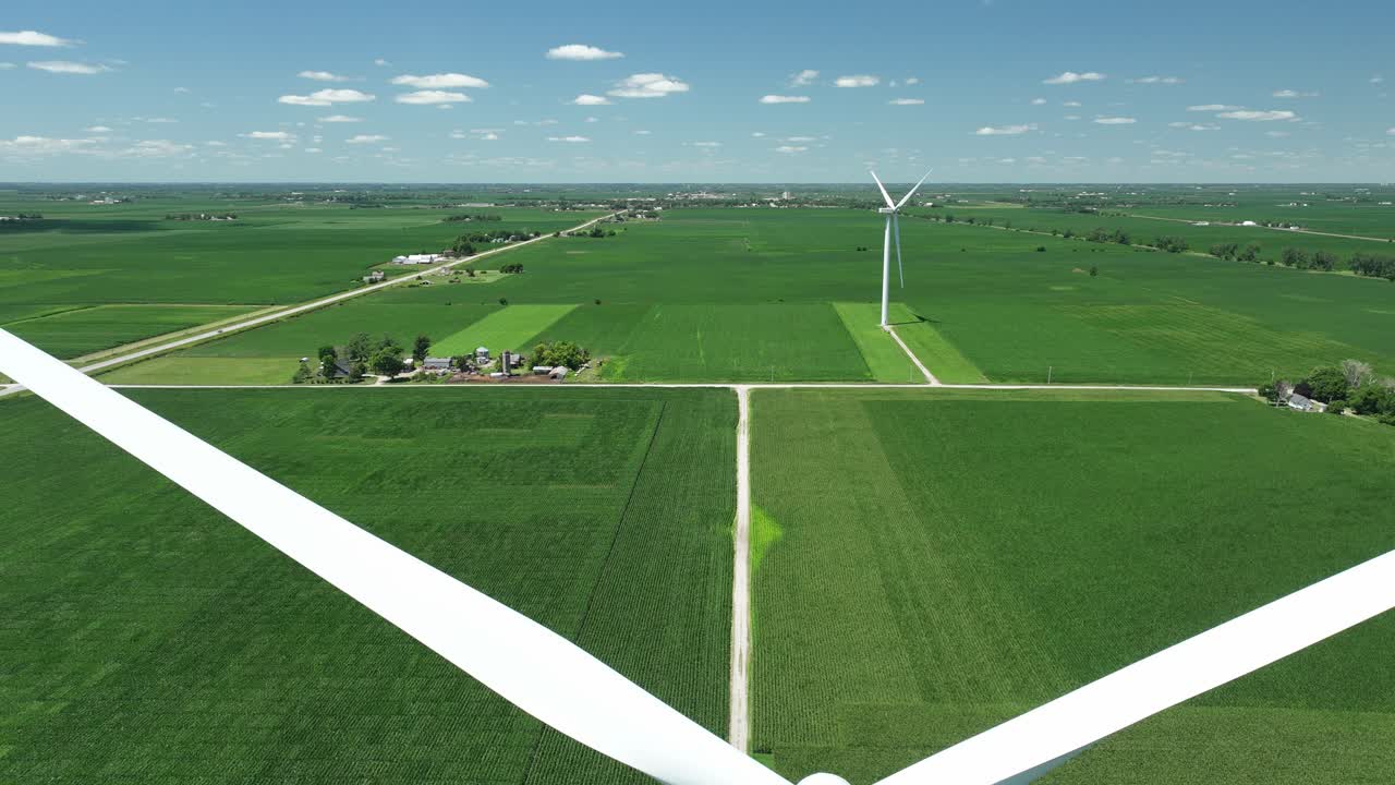 Static Wind Turbines On Lush Agricultural Fields In Slater, Iowa, USA