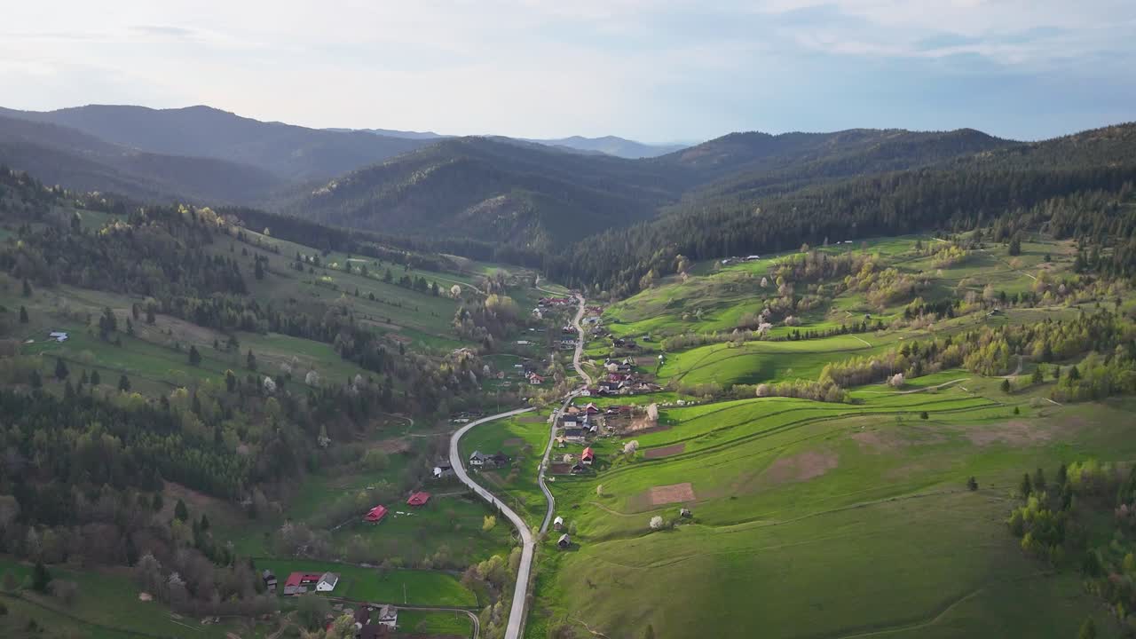 Drone video of Poiana Micului village at sunset surrounding by nature