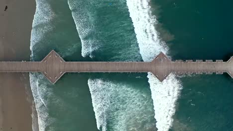 timelapse of ocean waves at pismo beach with pier in california, usa