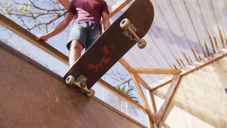 Video-of-middle-eastern-male-skateboarder-training-in-skate-park