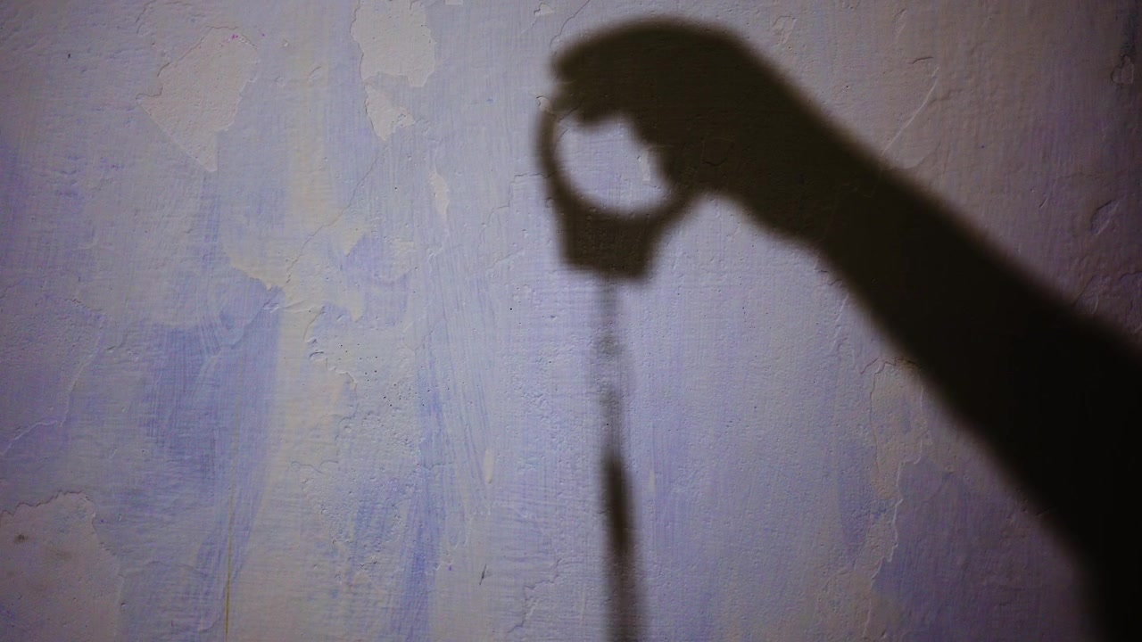 Dramatic Shadow of Police Handcuffs Representing Criminal Justice and Legal Authority