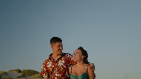 Cute-couple-walking-on-the-beach