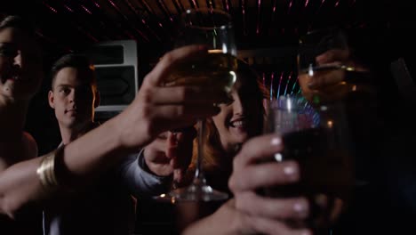 group of friends toasting glass of wine