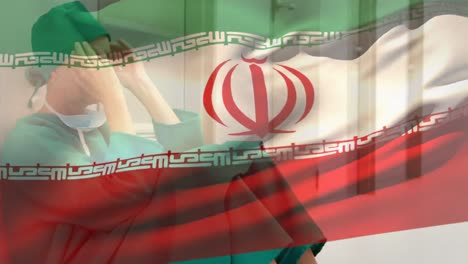 composición digital de la bandera de irán ondeando contra la estresada cirujana caucásica en el hospital