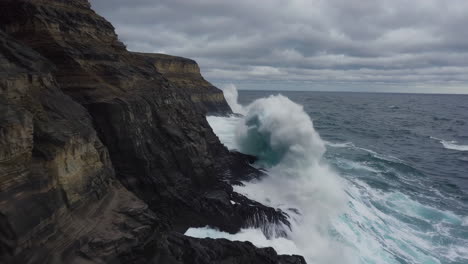 powerful waves crashing against rugged cliffs