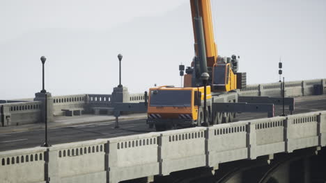 orange crane on a bridge