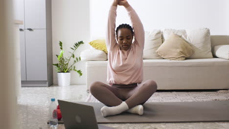 woman stretching at home