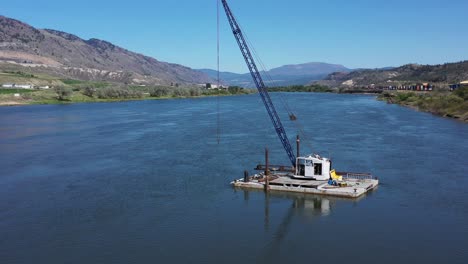 iconic on the thompson: kamloops' crane barge elevating operations