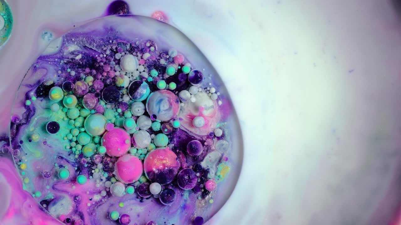 Colorful paint and bubbles abstract background 4k video