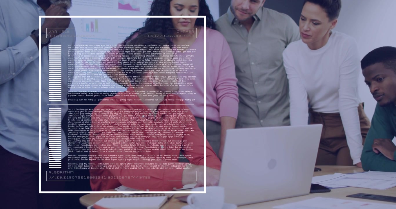 Uomo seduto in rosso che usa un laptop, mostrando un'interfaccia utente traslucida, mentre il team si china per esaminare i grafici aziendali.