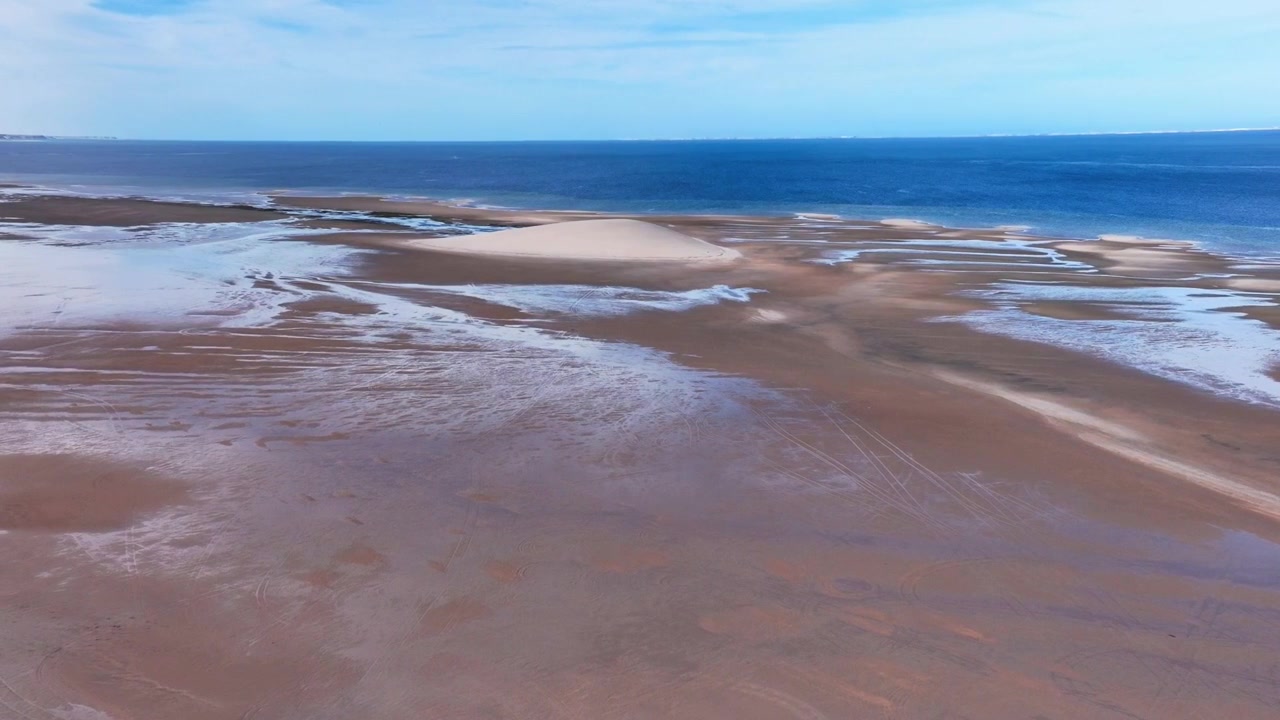 Drone aerial view of intertidal sandbars and tidal channels in Dakhla Lagoon, revealing dynamic coastal landforms created by tidal processes along Morocco's Atlantic shoreline.