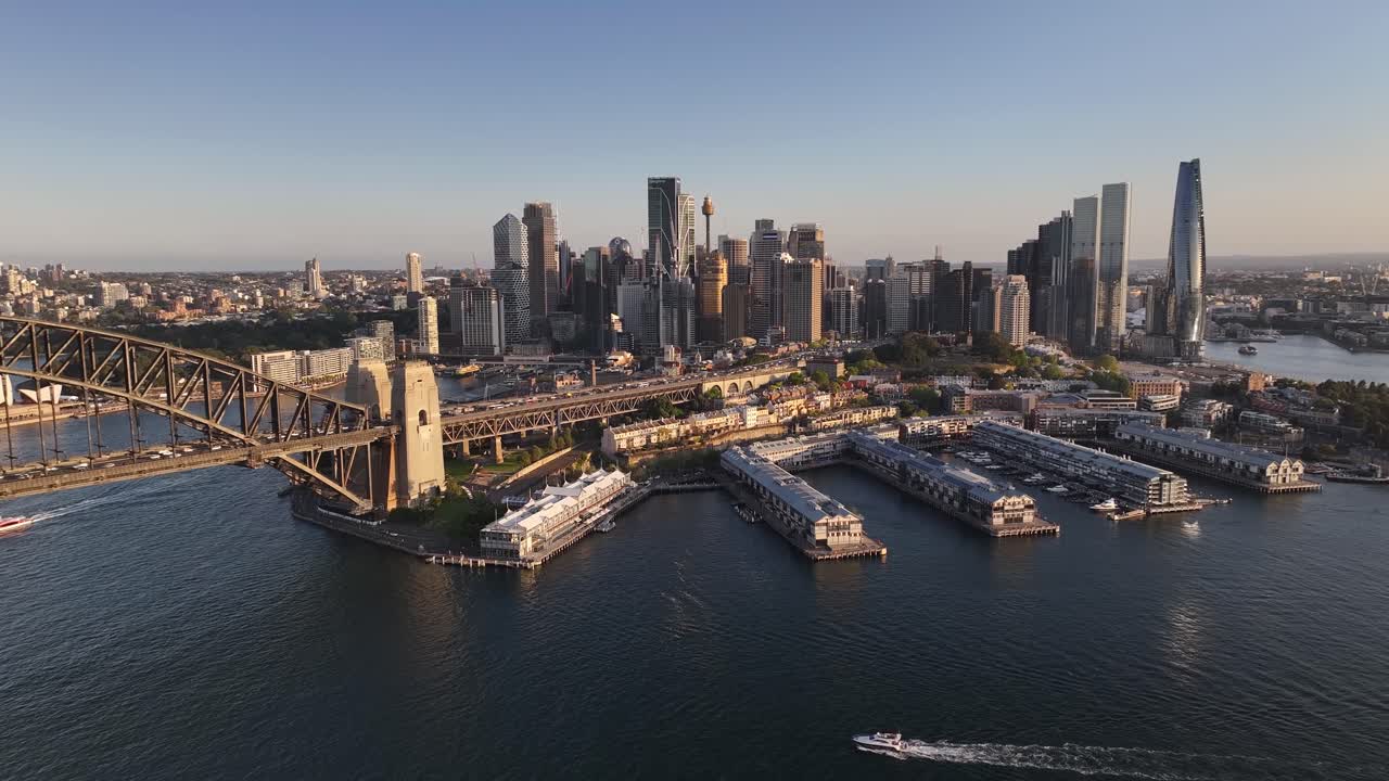 The Rocks, Harbour Bridge and Sydney Skyline. Amazing aerial view during warm sunset. Travel Destination
