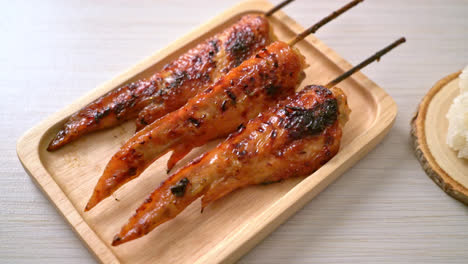 grilled or barbecue chicken wings skewer with sticky rice