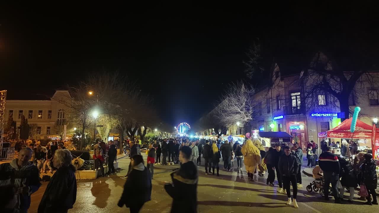 Night Street Fair with Ferris Wheel and Crowd of People