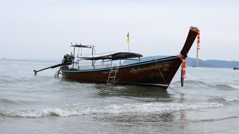 boat gently rocking on krabi's shoreline