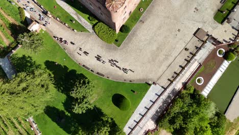 grinzane cavour castle, unesco site, cuneo, piedmont, italy. 4k aerial view of the castle together with the vineyard. langhe-roero and monferrato. top down zenital moving forward.