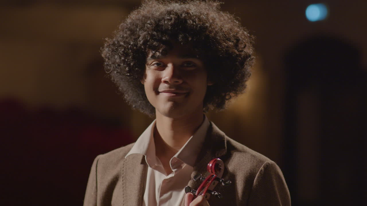 Portrait of Young African American Violinist On Stage