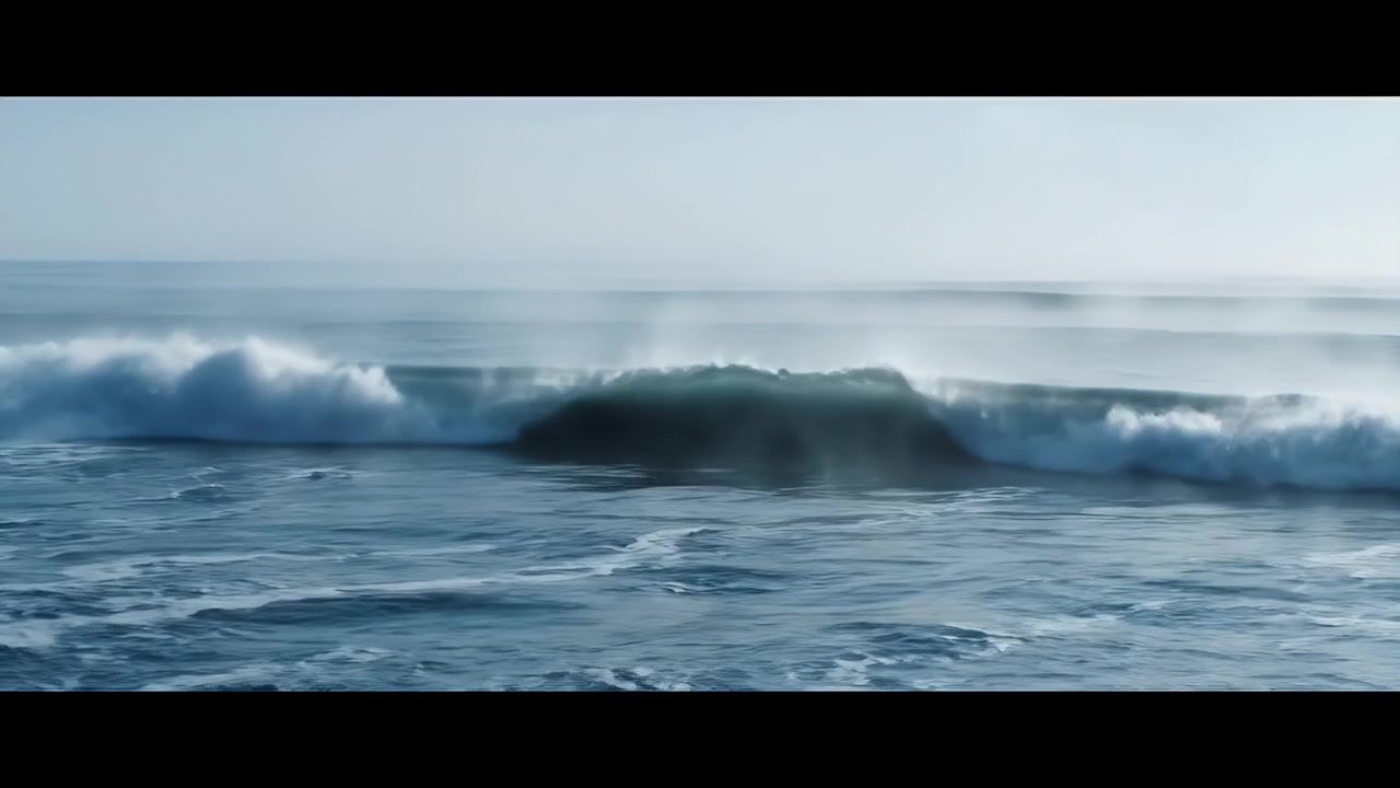Ocean Wave Breaking on Shoreline in Misty Morning Light