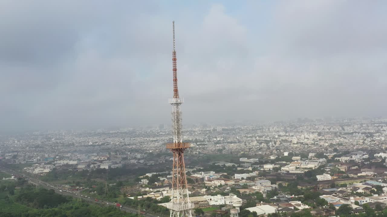 Aerial View of a City with a Tall Tower