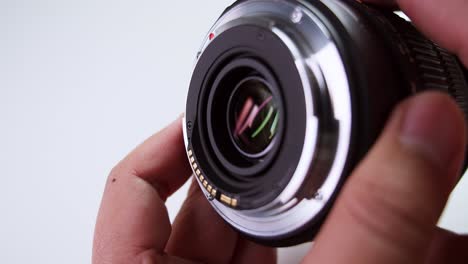 close-up of a camera technician checking and adjusting the lens