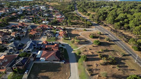Aerial-view-of-residential-area-in-suburb-area-of-Perth-City-during-sunny-day,-Western-Australia---Beautiful-neighborhood-near-ocean-and-forest