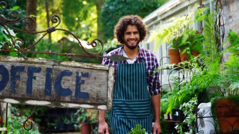 Gardener-walking-near-office-signboard