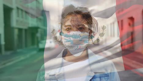 Animation-of-flag-of-mexico-waving-over-woman-wearing-face-mask-during-covid-19-pandemic