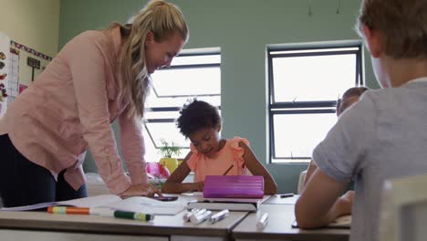 female teacher teaching kids in the class