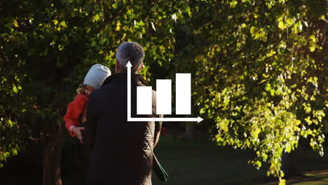 icono de la barra de gráfico contra el padre caucásico jugando con su hija en el parque