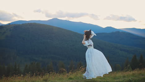 woman in white dress in the mountains
