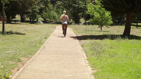 Jogging-woman-runs-down-the-footpath