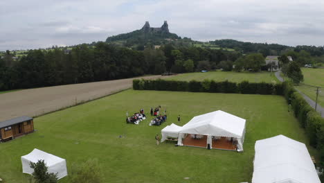 outdoor wedding ceremony in a garden,castle in the distance,czechia