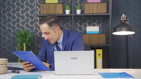 Businessman-signing-paperwork-feeling-happy.