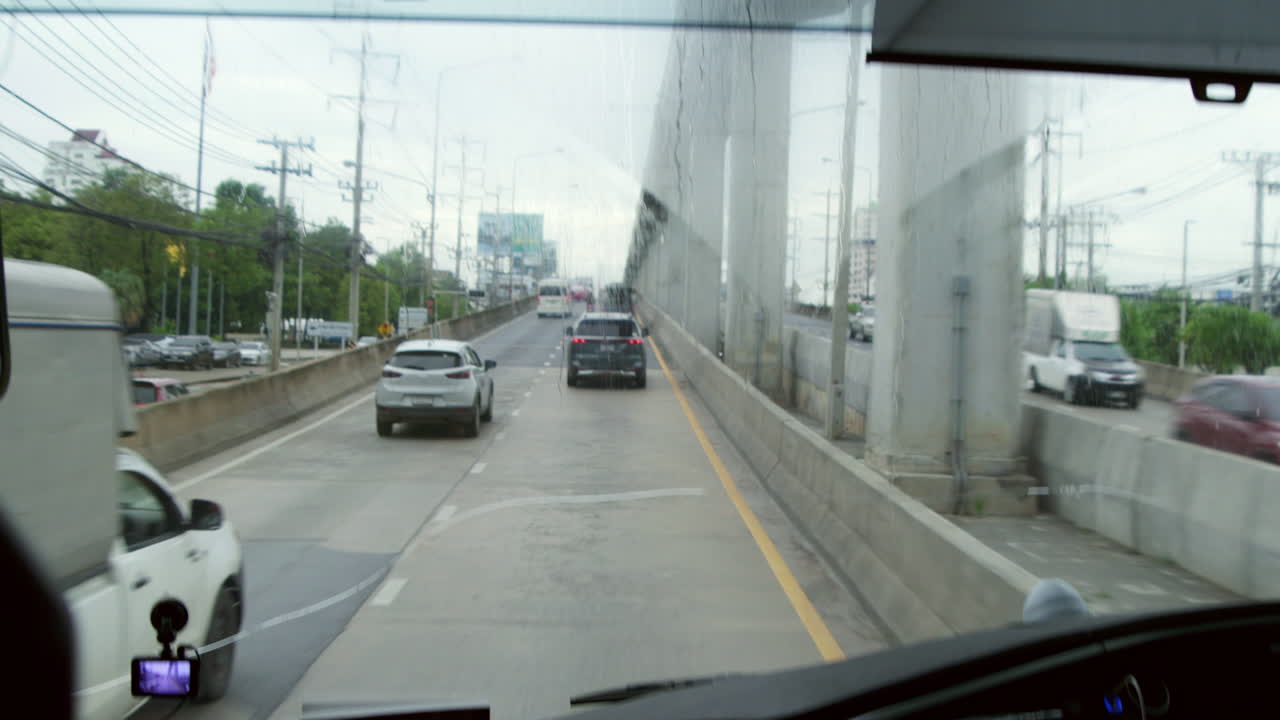 Driving a Bus on a Rainy Day in the City