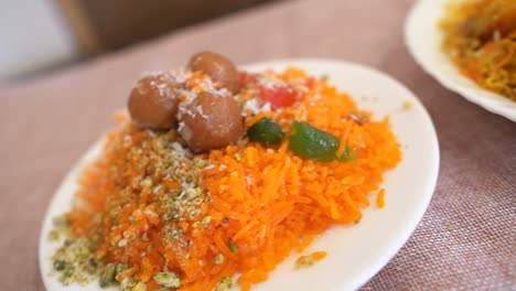 close up of indo and islamic dessert dish metha zarda or sweet rice or zarda or shkrana with all dry fruit including coconut and sugar