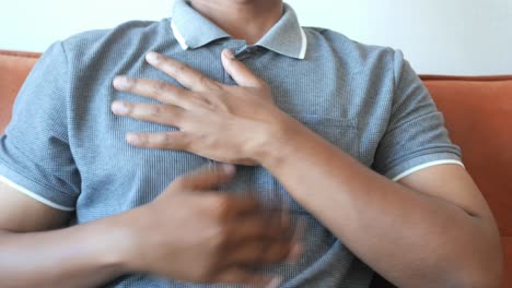 man experiencing chest pain