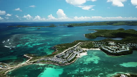 drone shot overlooking the shallow coast and vacation homes in sunny antigua