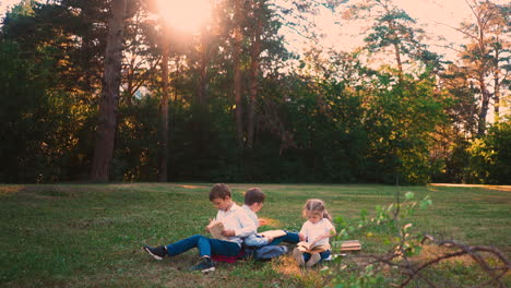 student sit on green meadow during school break