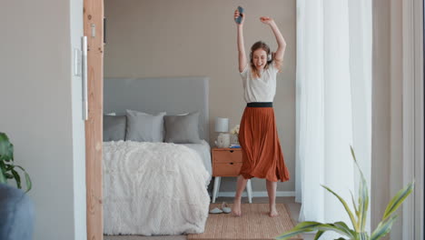 beautiful woman dancing at home having fun celebrating lifestyle achievement enjoying happy dance in penthouse apartment