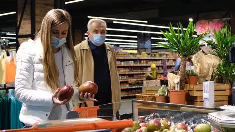 people buy citrus fruits during the coronavirus pandemic discounts on fruit in the supermarket people buy citrus fruits during the coronavirus pandemic usa new york may 10 2021