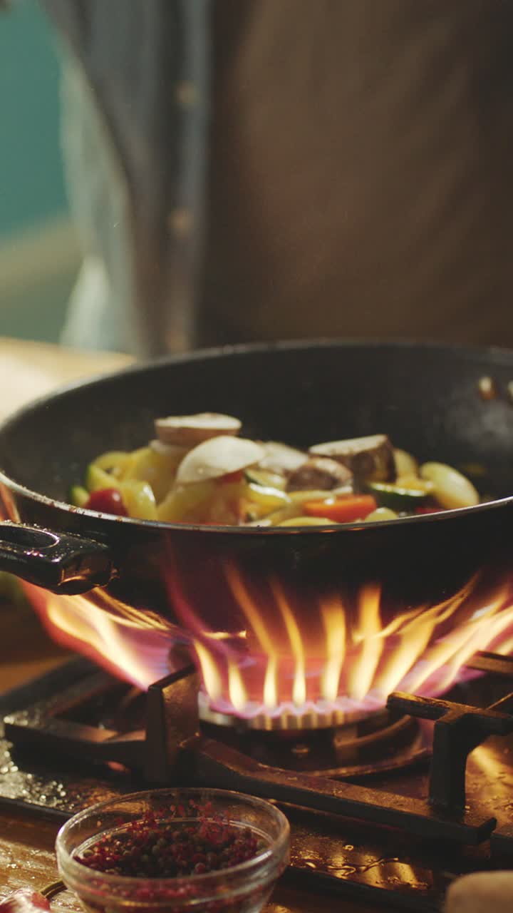 Cooking Vegetables in a Wok on a Gas Stove