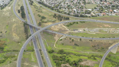 aerial view of a highway interchange with residential areas