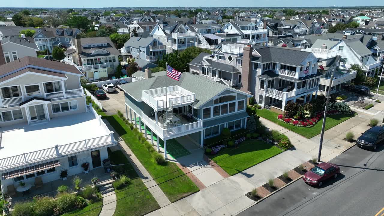 American flag waving on beach house